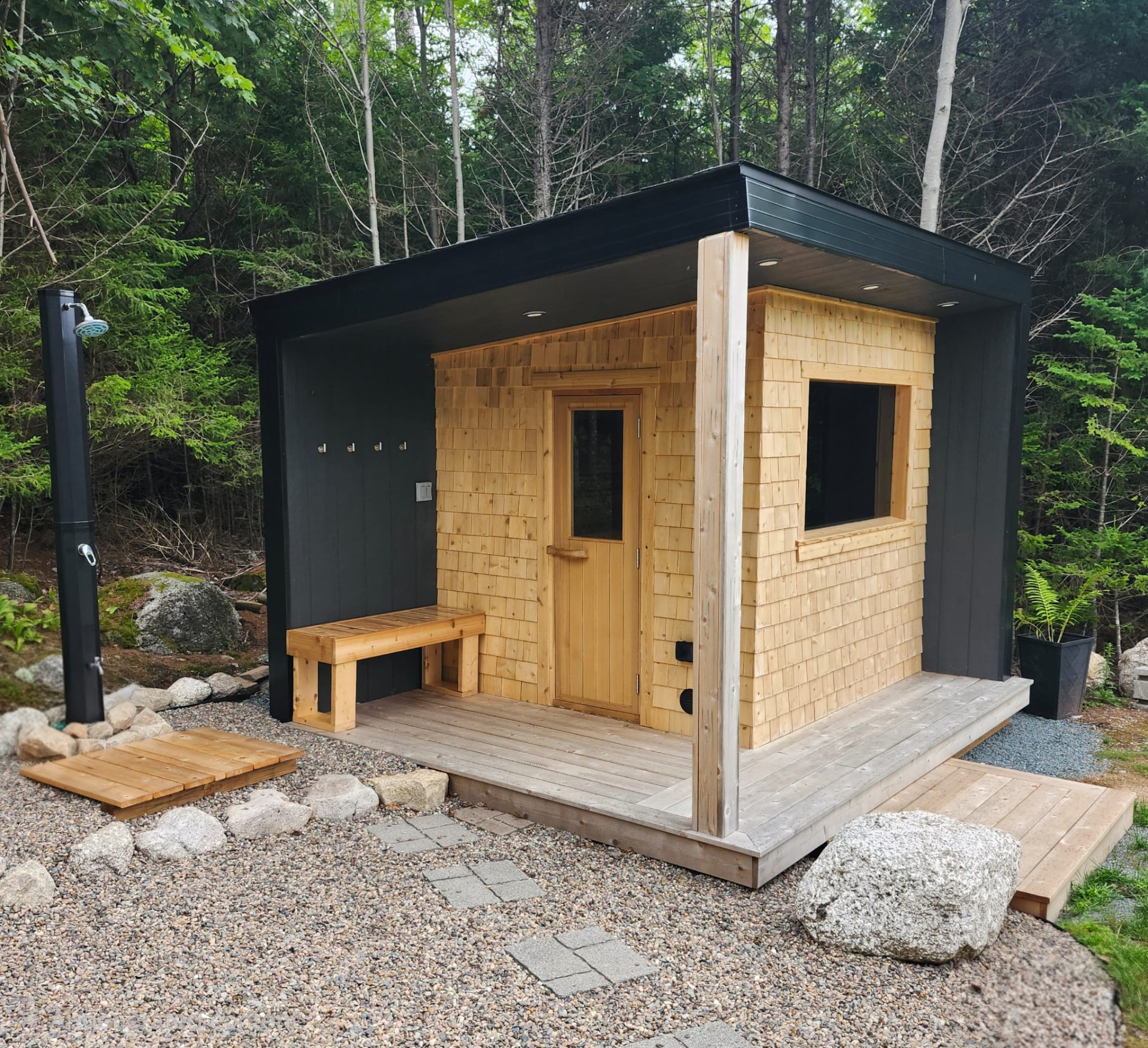 Custom-built cedar barrel sauna in a wooded Nova Scotia backyard